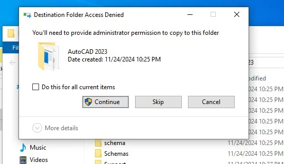 Xác nhận quyền quản trị bằng cách chọn 'Continue' để hoàn tất việc dán và ghi đè tệp tin cho AutoCAD 2023.